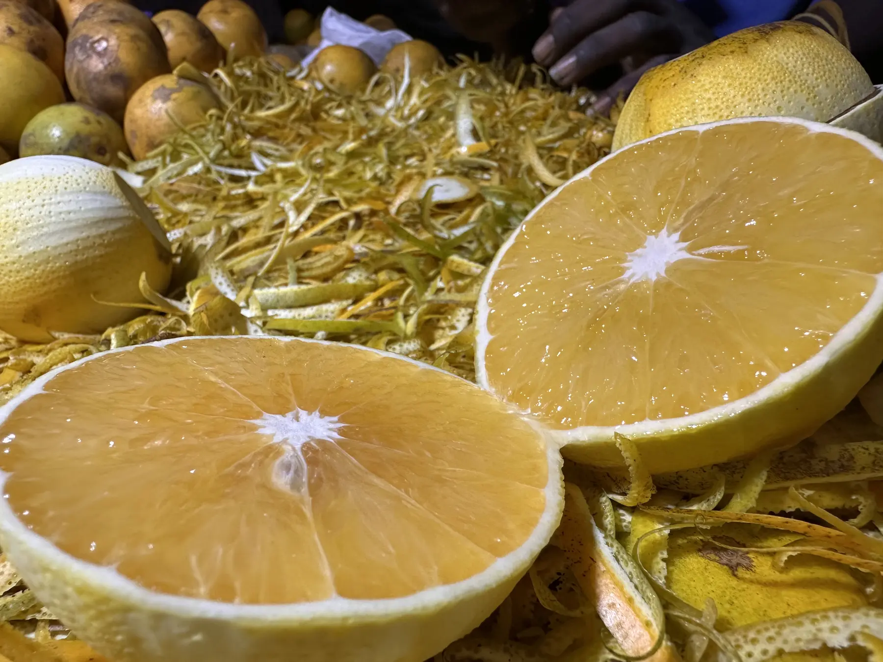 Fresh citrus halves and peels at a local market