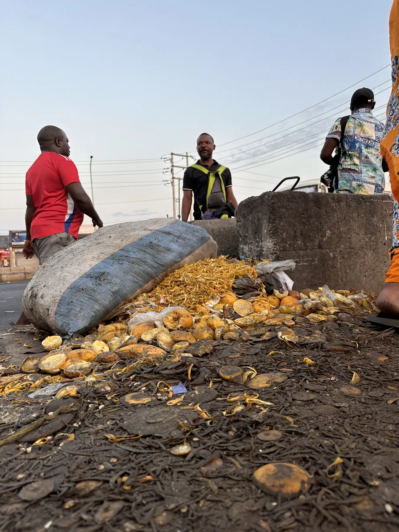Discarded citrus peels beside a market
